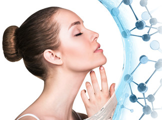 Beautiful young woman among blue glass molecules.