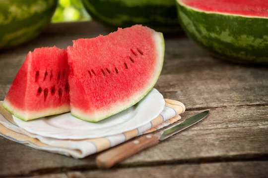 Sweet watermelon on plate and knife
