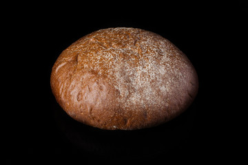Bread on a dark background.Loaf