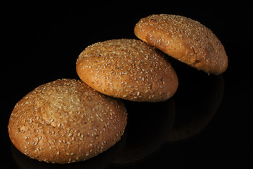 Bread with sesame seeds on a dark background