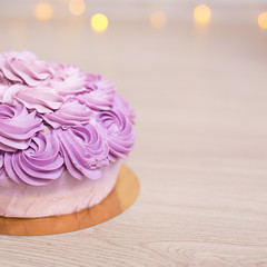 Obraz na płótnie Canvas birthday concept - purple cupcake on wooden table background