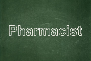 Obraz premium Medicine concept: text Pharmacist on Green chalkboard background