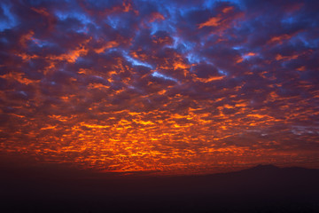 background of sunrise in the cloudy morning reflecting the lights of the sun