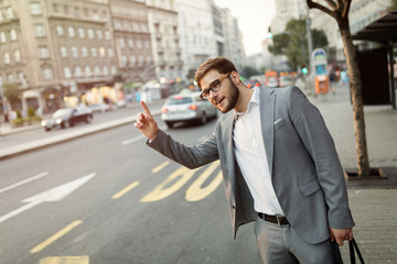 Businessman waving for a taxi