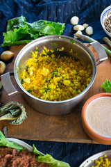 Pot with cooked bulgur wheat grain porridge with turmeric powder, garlic and spices served for lunch or dinner. Traditional arabic, asian, middle east. Vegan vegetarian healthy food