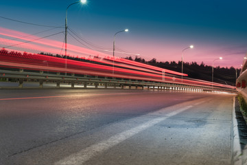 red lines / red light trails at night on the road