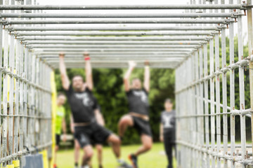 competitor runners in extreme obstacle course race