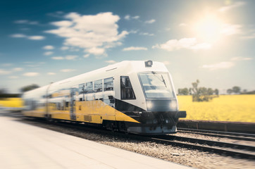 Naklejka premium Modern high speed train on a clear day with motion blur