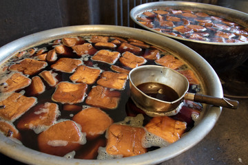 Production of tofu in the manufacture. Cooking tofu cubes in big pots, Thailand.
