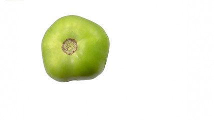 green tomato isolated on white top view