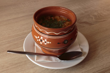 Fish soup in a clay pot.