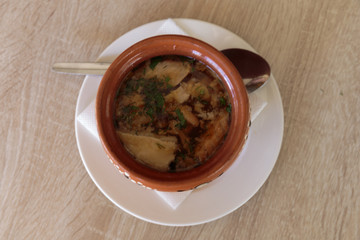 Fish soup in a clay pot.