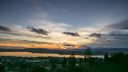winter view of a sunset on the Varese lake, Italy.