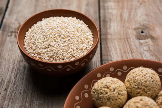 Amaranth or rajgira lahi in a bowl with sweet laddu. selective focus
