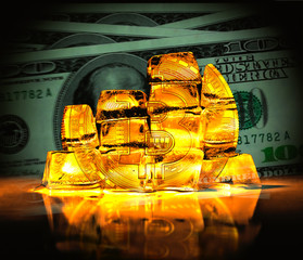 Bitcoin in the form of a coin collected from gold blocks of a dollars background