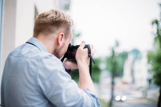 man is a traveler photographer, takes pictures of nature in the city.