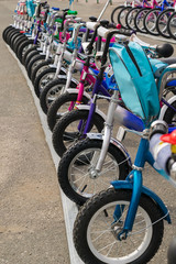 Parking of brand new children's bicycles on asphalt for sale