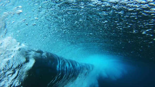 Crystal clear Indian Ocean wave barrels. Jailbreak surfspot near the island of Himmafushi, Maldives