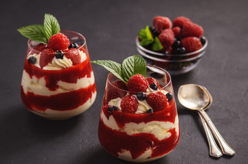 Strawberry mascarpone mousse dessert, on black background.