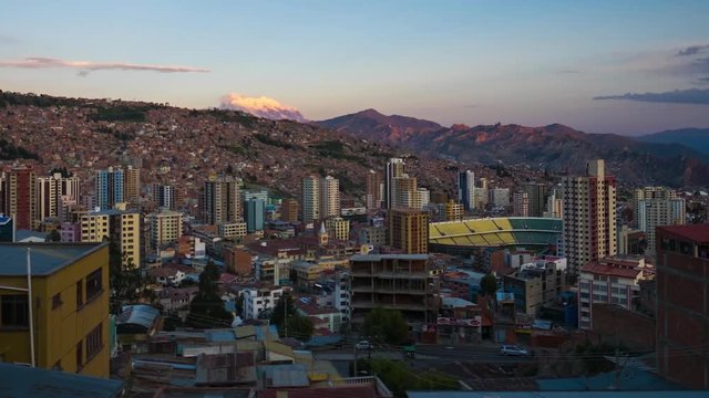 Zoom in day to night timelapse of the city of La Paz, Bolivia, sharp