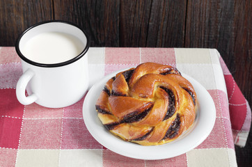 Bun and mug of milk