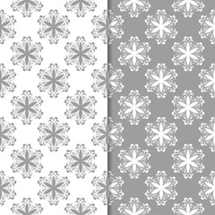 White and gray set of floral backgrounds. Seamless patterns