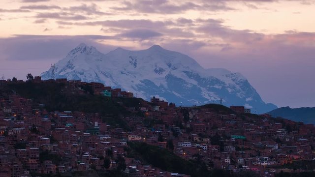 Zoom out sunrise timelapse of the city of La Paz, Bolivia
