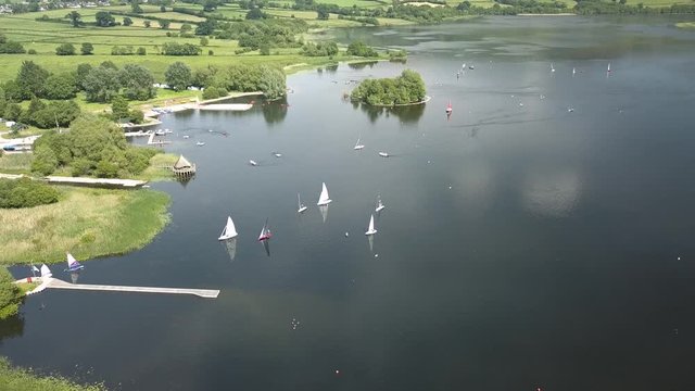 Aerial drone view of sailing boats and other users on a large inland lake (Llangorse Lake, Wales)