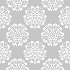 White flowers on gray background. Ornamental seamless pattern