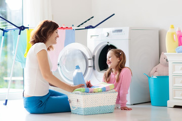 Family in laundry room with washing machine