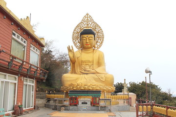 Gold Buddha Statue at Sanbangsa Temple, Jeju island, South Korea
