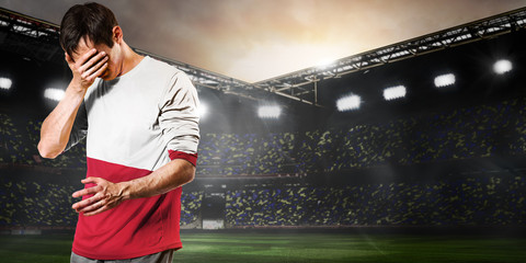 Poland national team. Sad soccer or football player on stadium