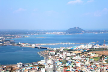 Cityscape and blue sea view from Seongsan Ilchulbong in Jeju island, South Korea