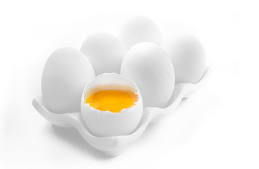 Six Large White Eggs on a White Ceramic Dish