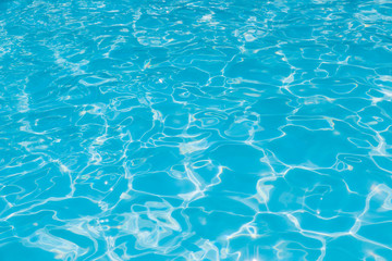 Blue and bright ripple water and surface in swimming pool, Beautiful motion gentle wave in pool