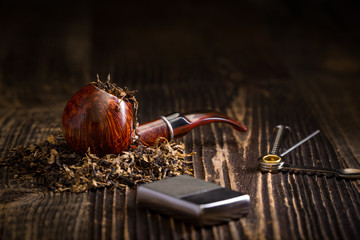 smoking pipe with tobacco leaves