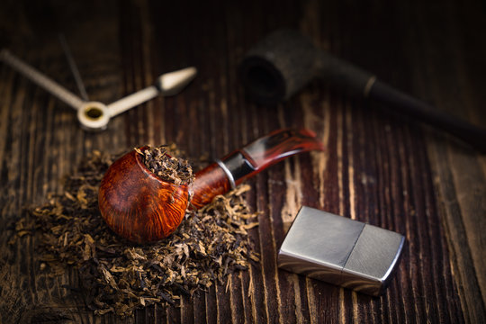 smoking pipe with tobacco leaves
