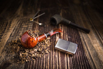 smoking pipe with tobacco leaves