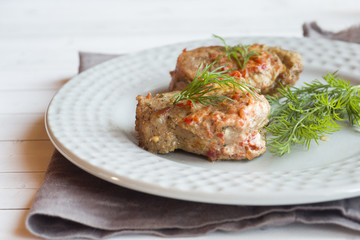 Delicious pieces of baked meat with fresh vegetables on the table