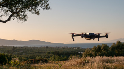 Fototapeta na wymiar drone hovering during sunset