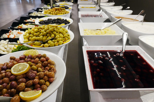 Olives and sauces on the buffet.