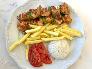 Turkish Chicken Shish Kebab with Rice (Pilav or Pilaf) Potatoes and Tomato / Sis Kebap.