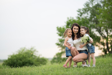 Fototapeta premium woman and children in nature
