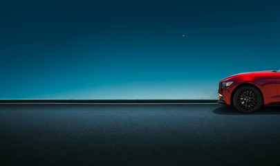 Sport car parked on road side with night sky background . - obrazy, fototapety, plakaty