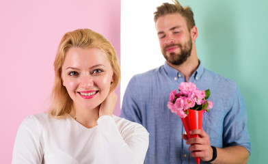 Little surprise for her. Boyfriend bring bouquet flowers to surprise her. Man ready for perfect...
