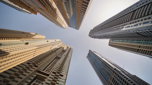 High-rise skyscrapers of Dubai. Shooting in motion and rotation.