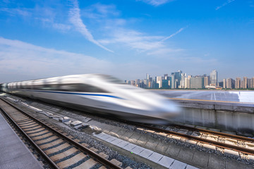 Naklejka premium high speed train with city skyline
