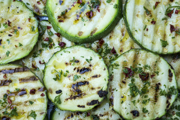 grilled zucchini with spicy chili, parsley and olive oil
