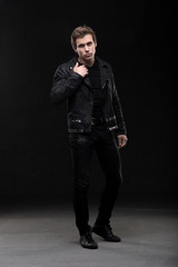 Handsome man in black leather jacket shot