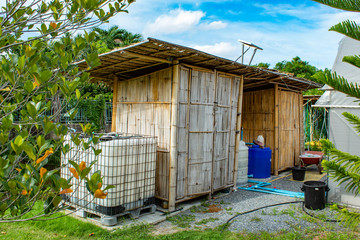 House built of bamboo in garden.
